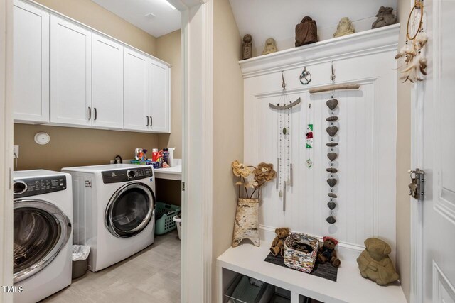 108 Boone St, Chapel Hill, NC 27516 - washroom with cabinet space and washer and clothes dryer