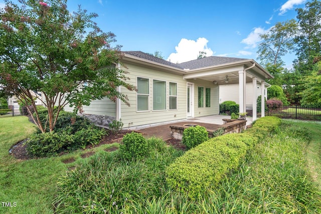 108 Boone St, Chapel Hill, NC 27516 - back of house featuring a lawn, fence, a ceiling fan, and a patio area