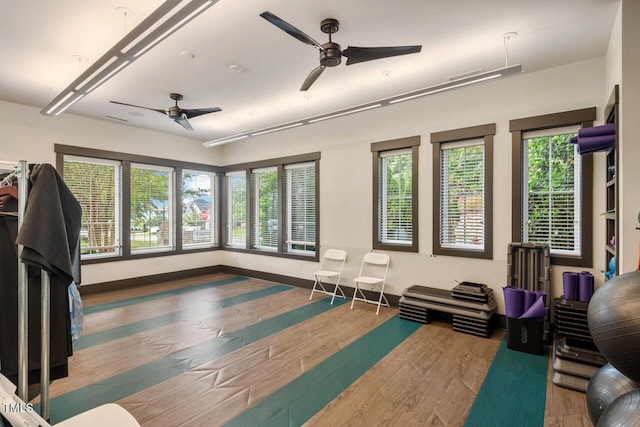 108 Boone St, Chapel Hill, NC 27516 - workout room with baseboards, ceiling fan, and wood finished floors