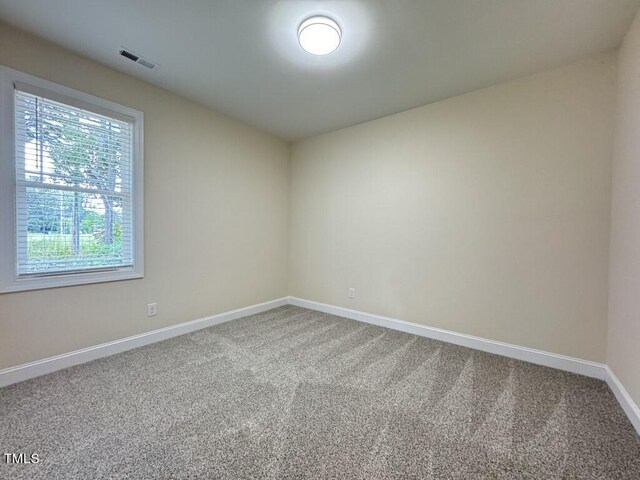 unfurnished room featuring carpet flooring