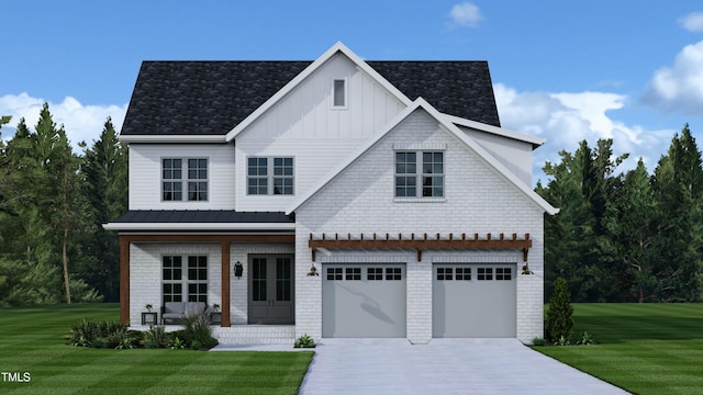 view of front of house featuring a garage, a front lawn, and french doors