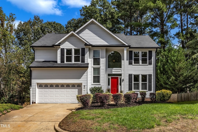 view of front facade with a front lawn and a garage