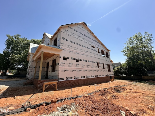 208 E Whitaker Mill Rd, Raleigh, NC 27608 - view of side of home featuring metal roof