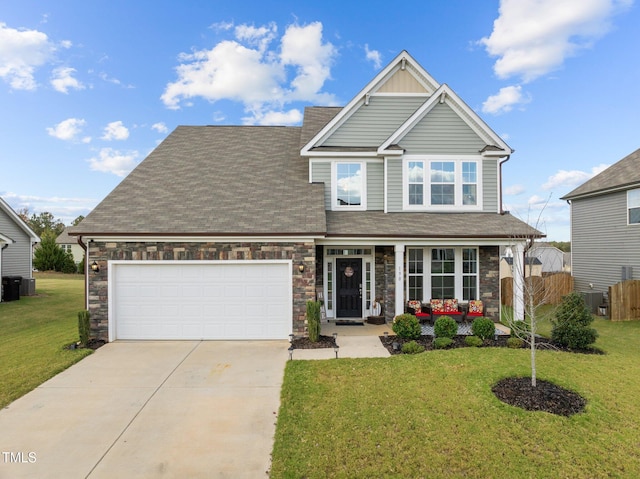 craftsman inspired home featuring a garage, a front yard, and covered porch