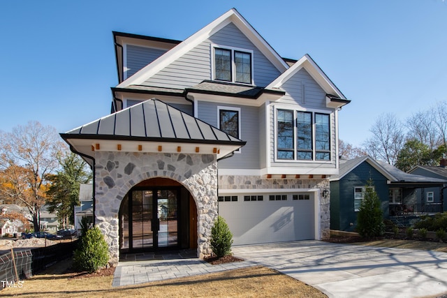 view of front of house with french doors and a garage