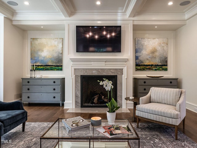 living room featuring beamed ceiling, dark hardwood / wood-style flooring, crown molding, and a high end fireplace