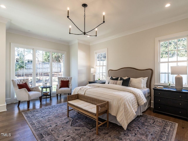 bedroom with dark hardwood / wood-style floors, crown molding, and multiple windows