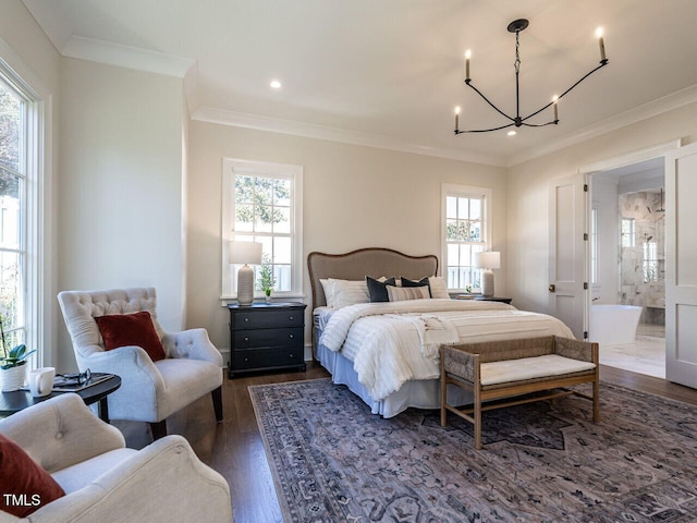 bedroom featuring a notable chandelier, dark hardwood / wood-style floors, connected bathroom, and multiple windows