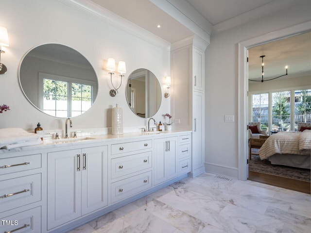 bathroom with vanity and crown molding