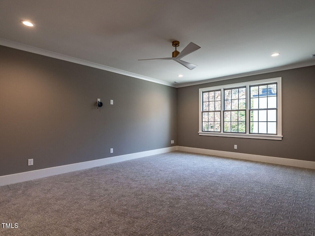 empty room featuring carpet flooring, ceiling fan, and crown molding