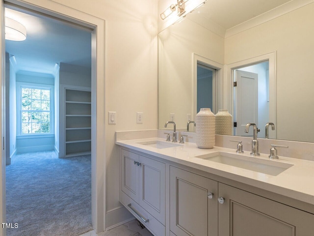 bathroom featuring vanity and crown molding