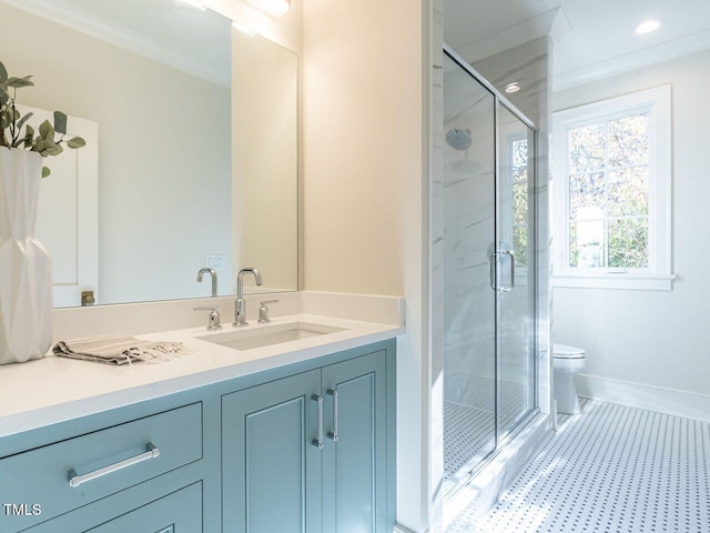 bathroom with vanity, toilet, an enclosed shower, and crown molding