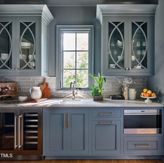 1307 Mayfair Rd, Raleigh, NC 27608 - bar featuring beverage cooler, tasteful backsplash, and wall oven