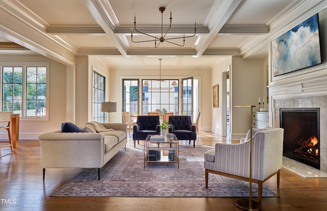1307 Mayfair Rd, Raleigh, NC 27608 - living room with a chandelier, wood finished floors, ornamental molding, a premium fireplace, and coffered ceiling
