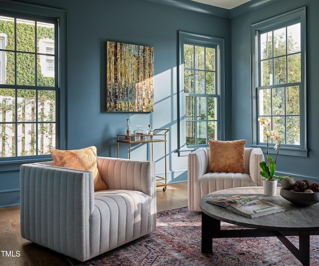 1307 Mayfair Rd, Raleigh, NC 27608 - sitting room featuring plenty of natural light and wood finished floors