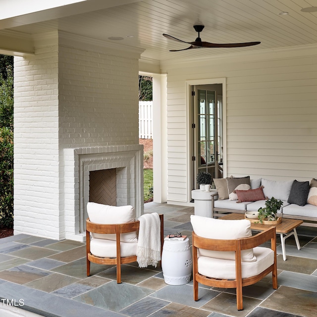 1307 Mayfair Rd, Raleigh, NC 27608 - view of patio / terrace with an outdoor living space with a fireplace and a ceiling fan