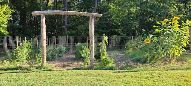 view of yard featuring a garden and fence