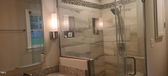 full bathroom with a shower stall