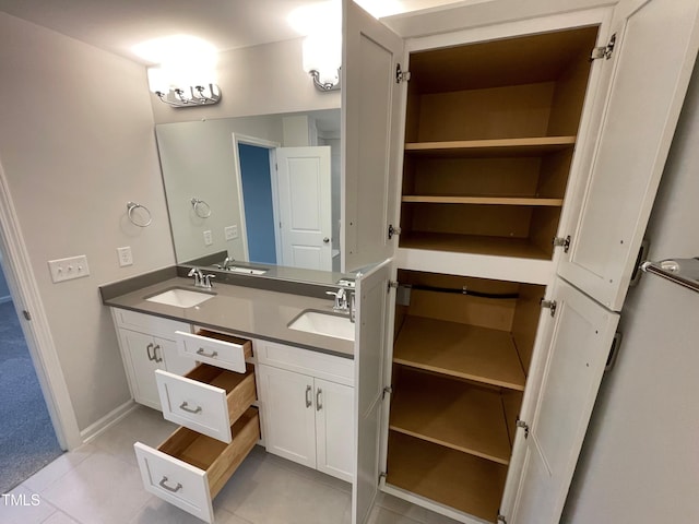 bathroom featuring tile patterned flooring and vanity