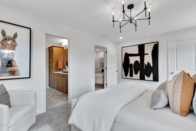 bedroom with a chandelier, light carpet, and connected bathroom