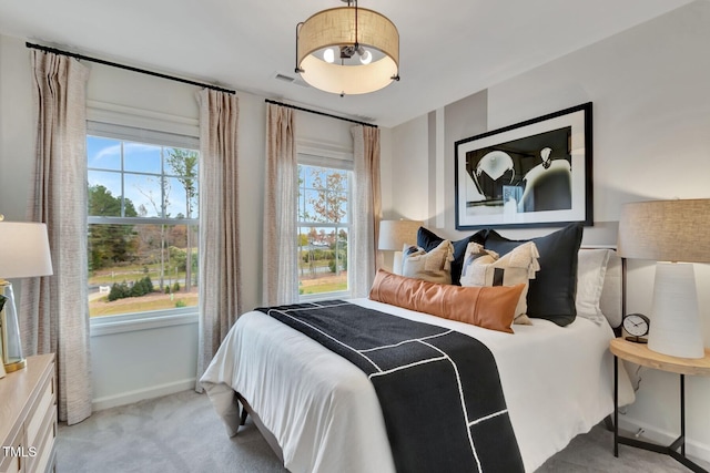 bedroom with light colored carpet