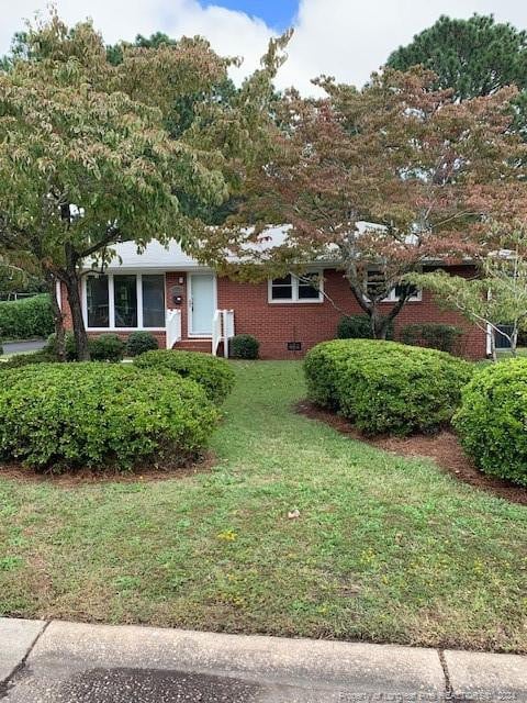 view of front of home with a front yard