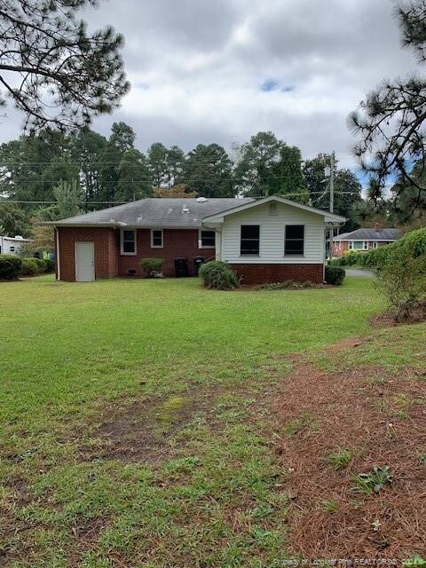 view of front of home with a front yard