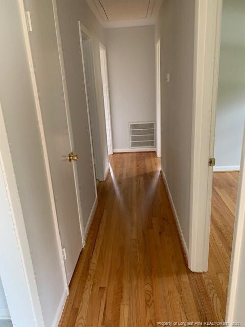 hallway featuring hardwood / wood-style flooring