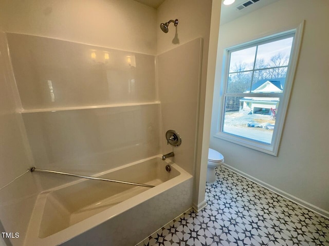 bathroom featuring shower / washtub combination, baseboards, visible vents, and toilet