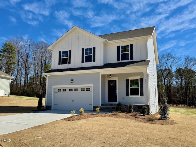 view of front of home featuring a garage, driveway, and board and batten siding