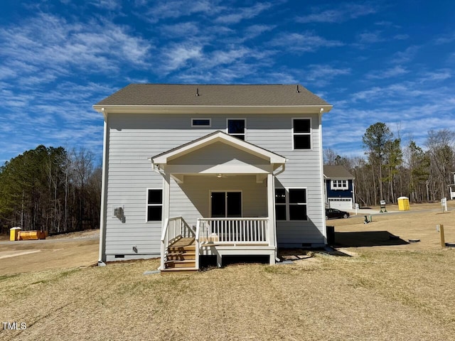 back of house featuring crawl space and a porch