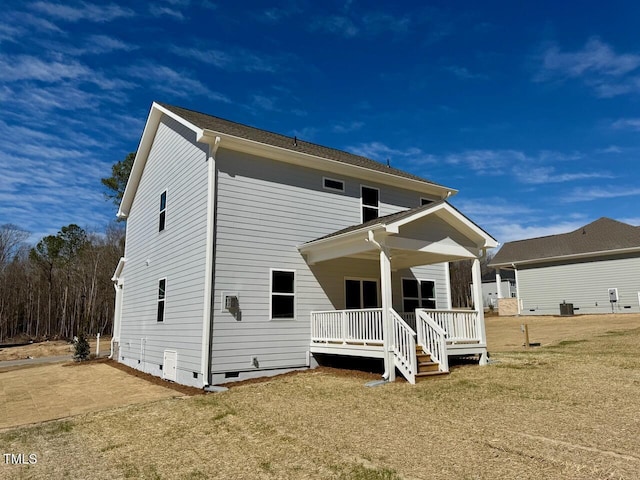 view of front of property with central AC unit and crawl space