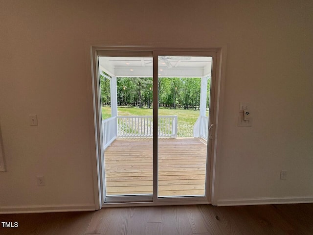 235 Grand Griffon Way, Lillington, NC 27546 - doorway to outside featuring baseboards and wood finished floors