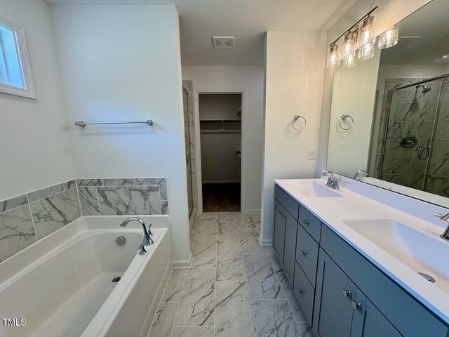 235 Grand Griffon Way, Lillington, NC 27546 - full bath featuring marble finish floors, a shower stall, a walk in closet, a bath, and double vanity