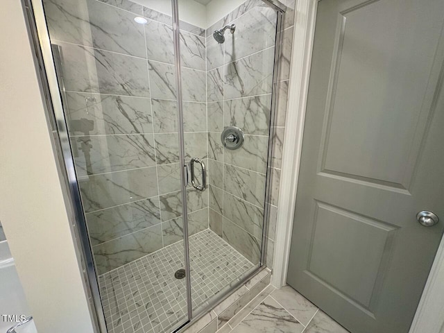 235 Grand Griffon Way, Lillington, NC 27546 - bathroom featuring marble look tiles and a stall shower