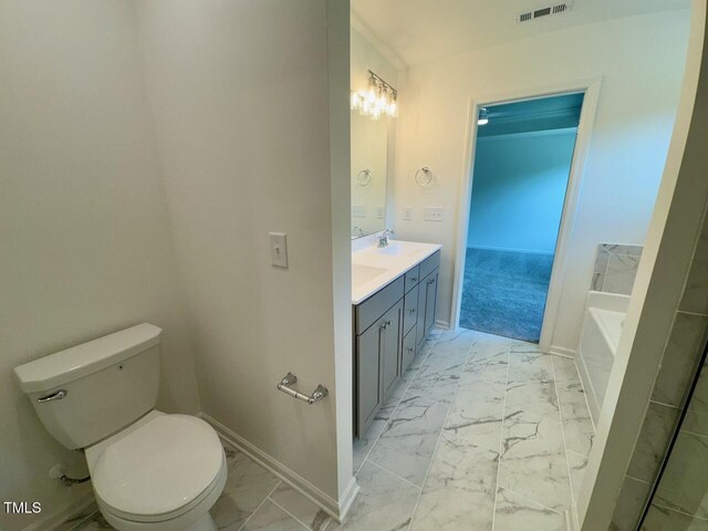 235 Grand Griffon Way, Lillington, NC 27546 - full bath with marble look tiles, baseboards, and toilet