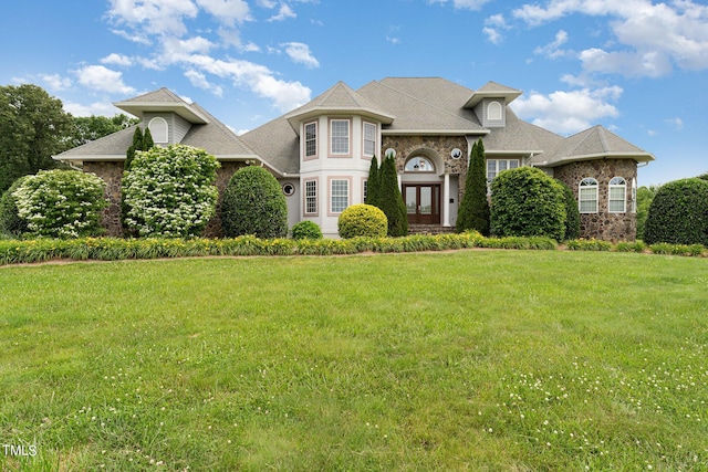 view of front of house with french doors and a front yard