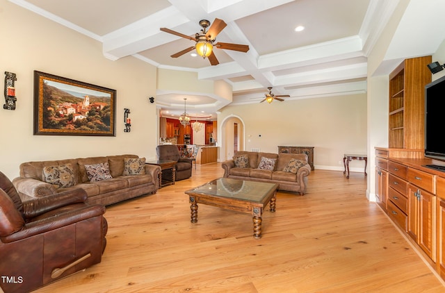 living room with ornamental molding, coffered ceiling, ceiling fan with notable chandelier, beam ceiling, and light hardwood / wood-style flooring