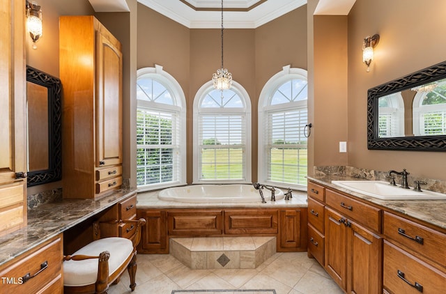 bathroom with tile patterned flooring, vanity, ornamental molding, and tiled tub