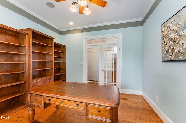 office space featuring crown molding, french doors, ceiling fan, and light hardwood / wood-style floors