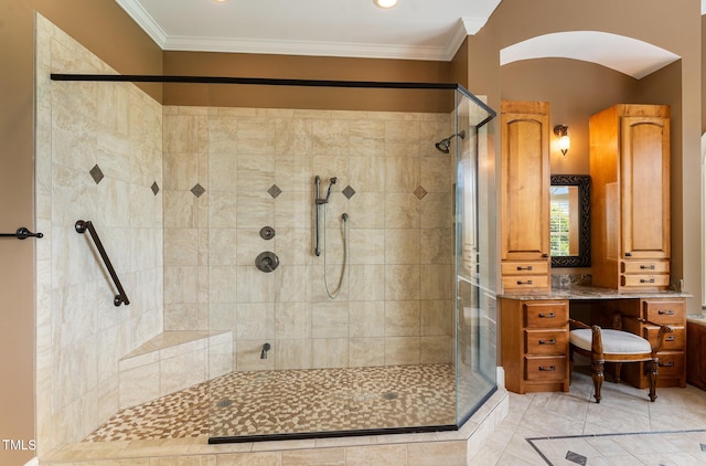 bathroom with tile patterned flooring, a shower with shower door, and crown molding