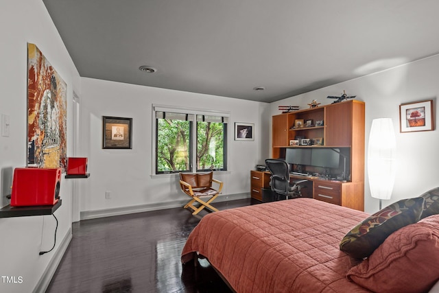 bedroom featuring dark hardwood / wood-style floors