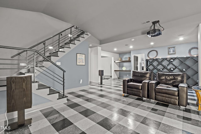 cinema room featuring vaulted ceiling