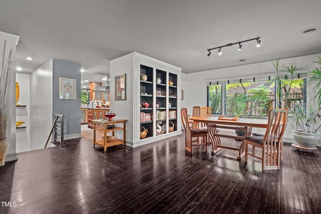 dining area with wood-type flooring, visible vents, and recessed lighting