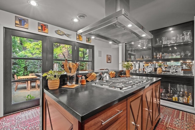bar featuring visible vents, wet bar, recessed lighting, stainless steel gas stovetop, and island range hood