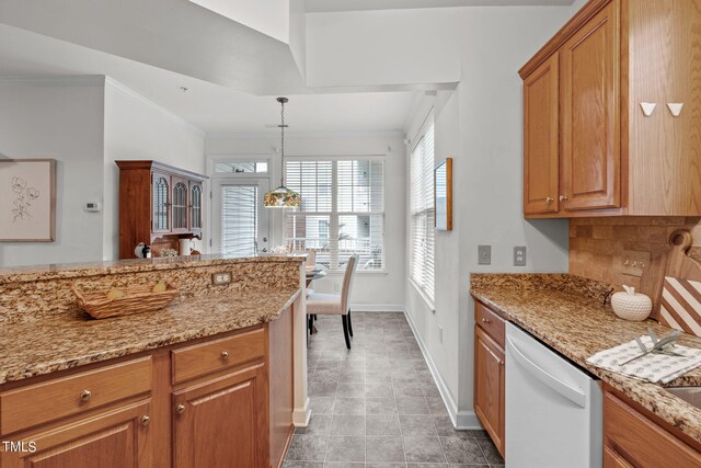 kitchen with light stone counters, hanging light fixtures, dishwasher, crown molding, and decorative backsplash