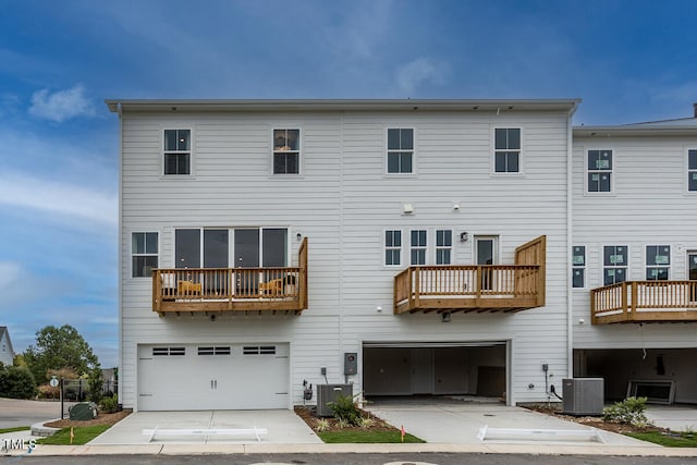 back of house with cooling unit and a balcony