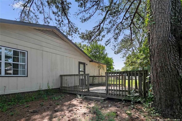 view of property exterior featuring a deck