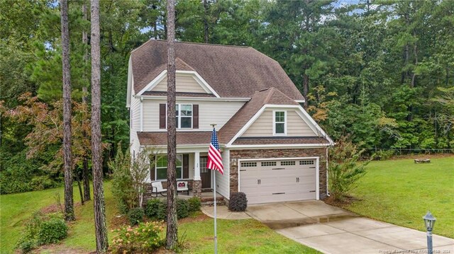 view of front facade with a front yard and a garage