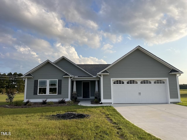 53 Grace Ridge Ct, Benson, NC 27504 - view of front facade featuring a garage, driveway, and a front yard